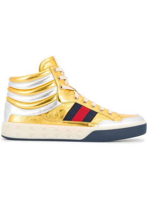 gold Gucci high top sneakers